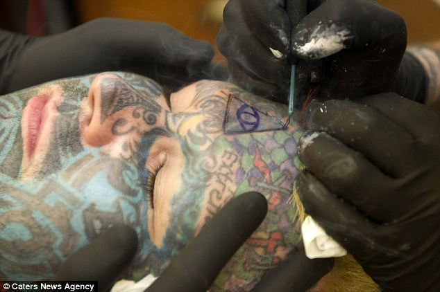 Extreme body art: Mr Whelan, who has legally changed his name to His Royal Majesty Body Art, King of Ink Land said he was having the procedure to 