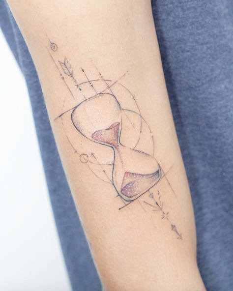 Subtle hourglass tattoo by Hello Tattoo