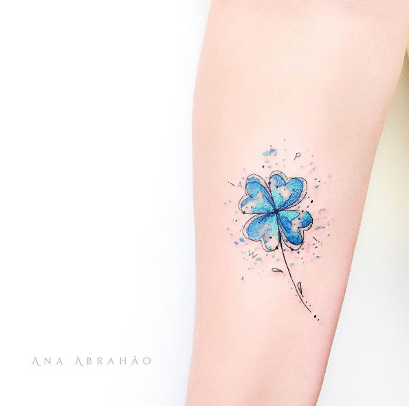 Blue four-leaf clover tattoo by Ana Abrahao