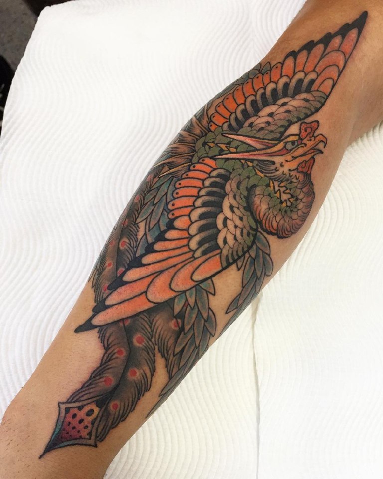 Феникс на руке татуировка