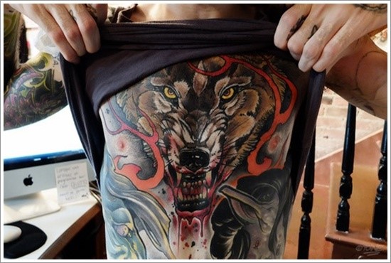 large wolf tattoo on stomach
