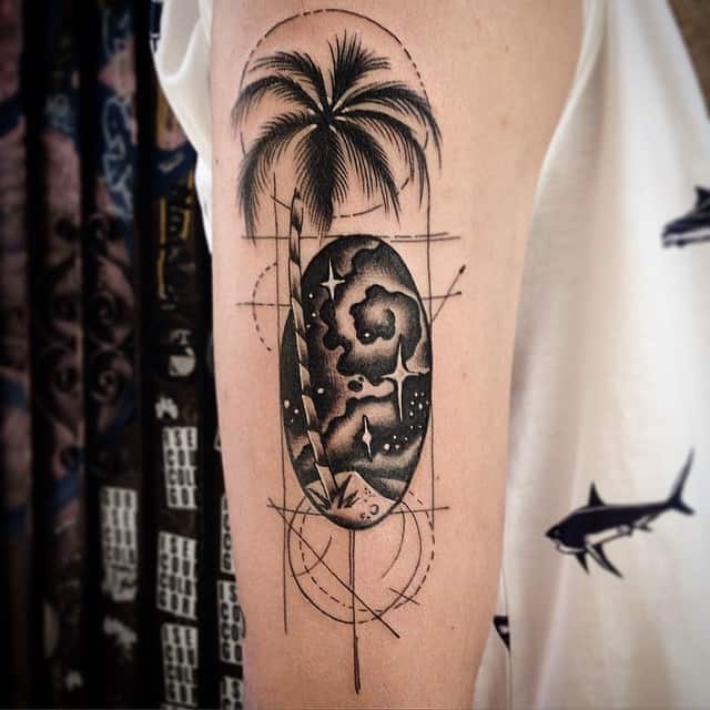 geometric palm tree tattoo on arm